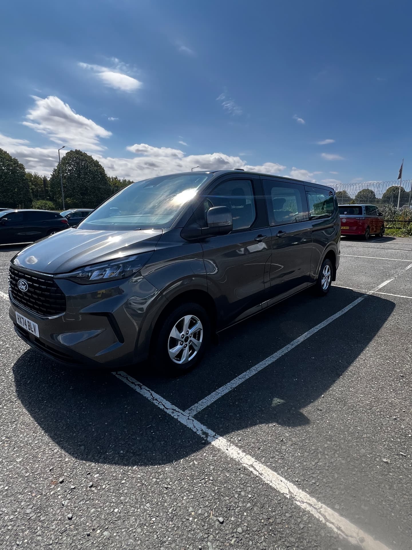 Grey Ford Transit Custom crew van gleaming after a full valet