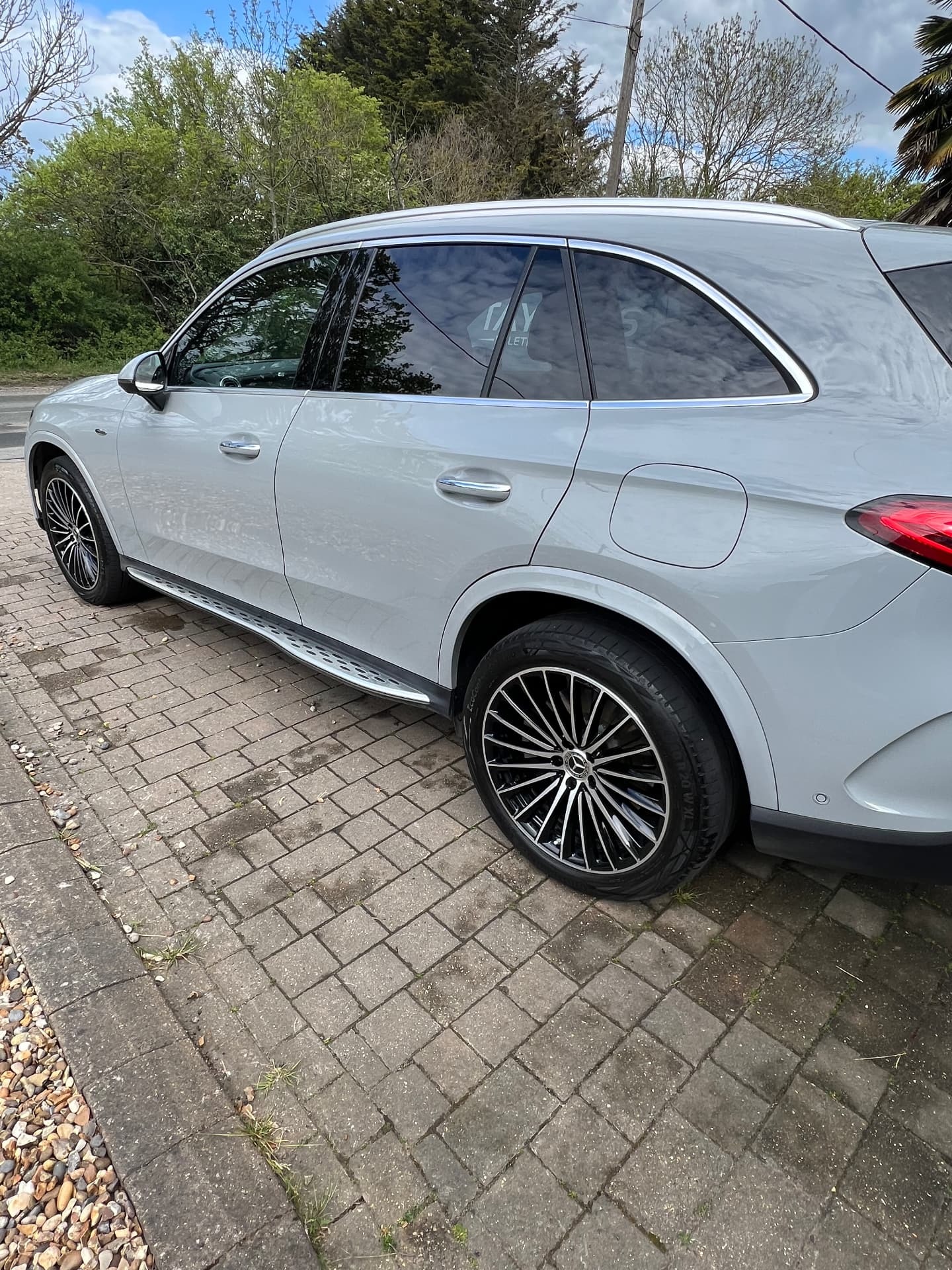 White Mercedes GLC gleaming on a block-paved driveway after a full valet