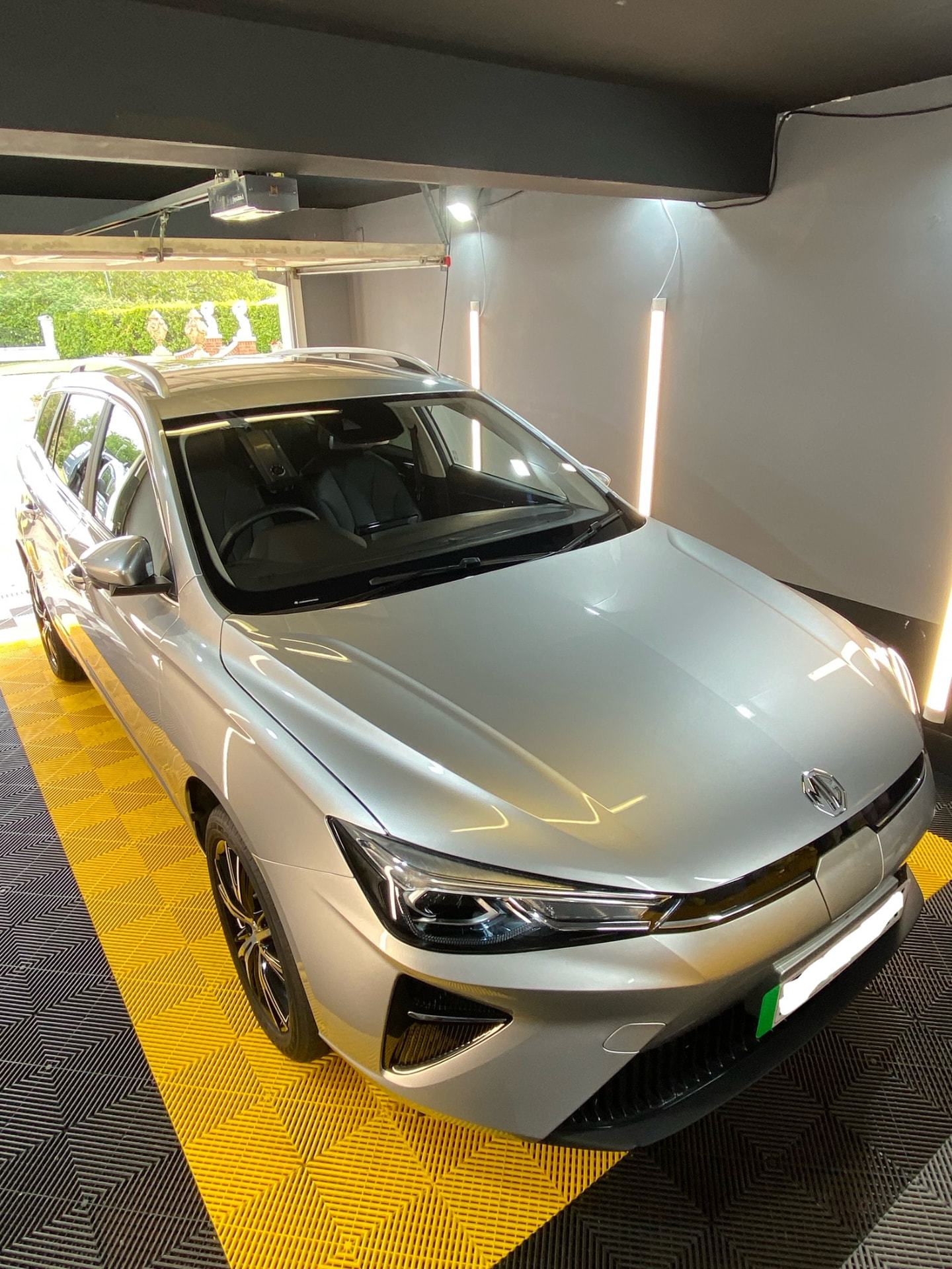 Silver MG5 estate detailed under the lights in the Daws Heath unit