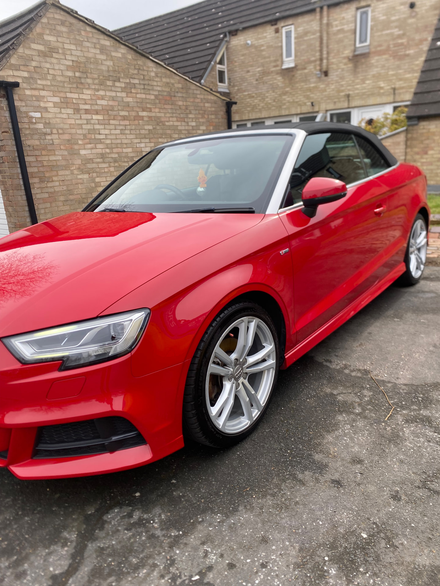 Red Audi A3 S line cabriolet valeted to a bright gloss on a driveway