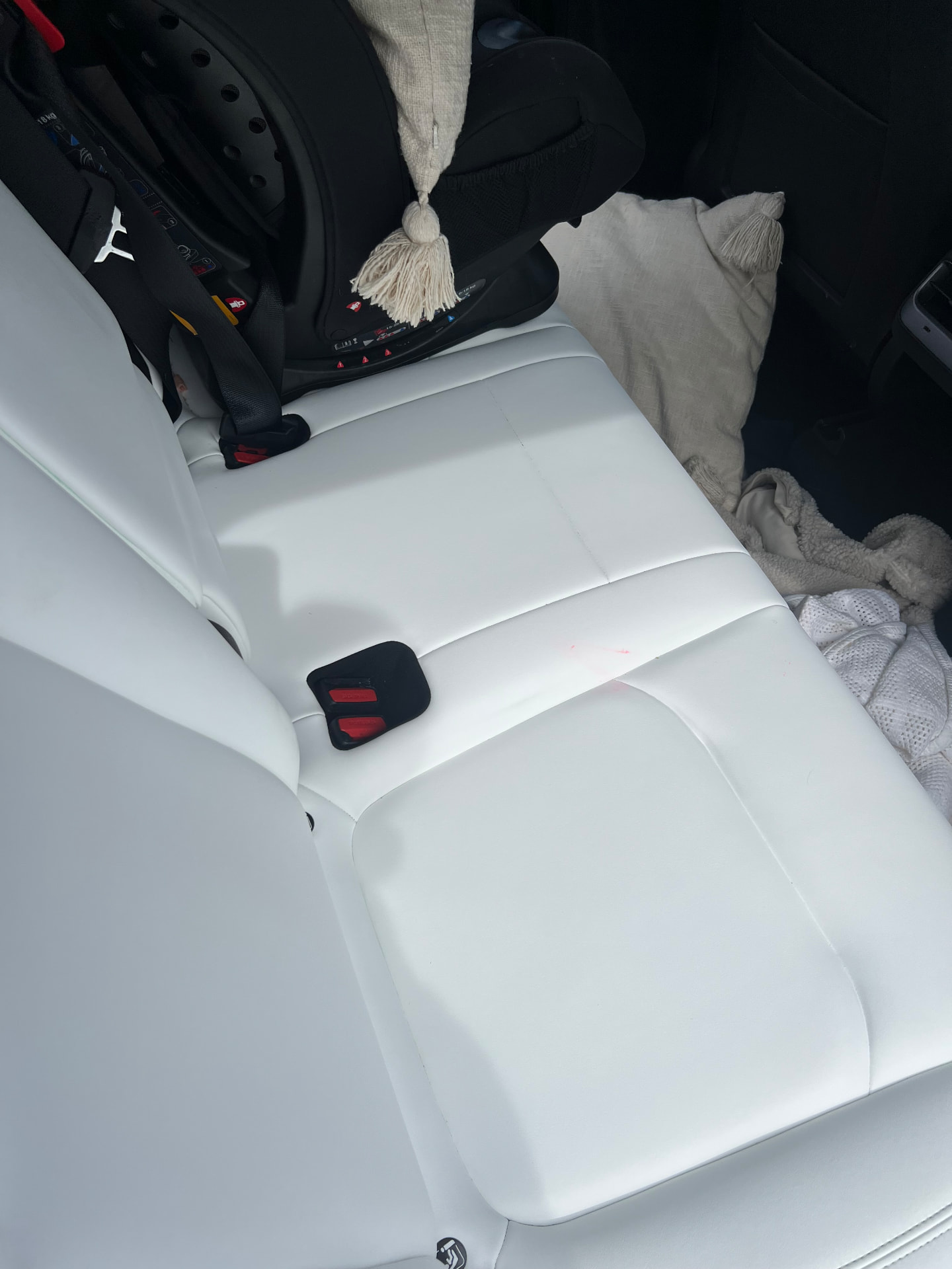 The same white leather rear seats cleaned back to spotless