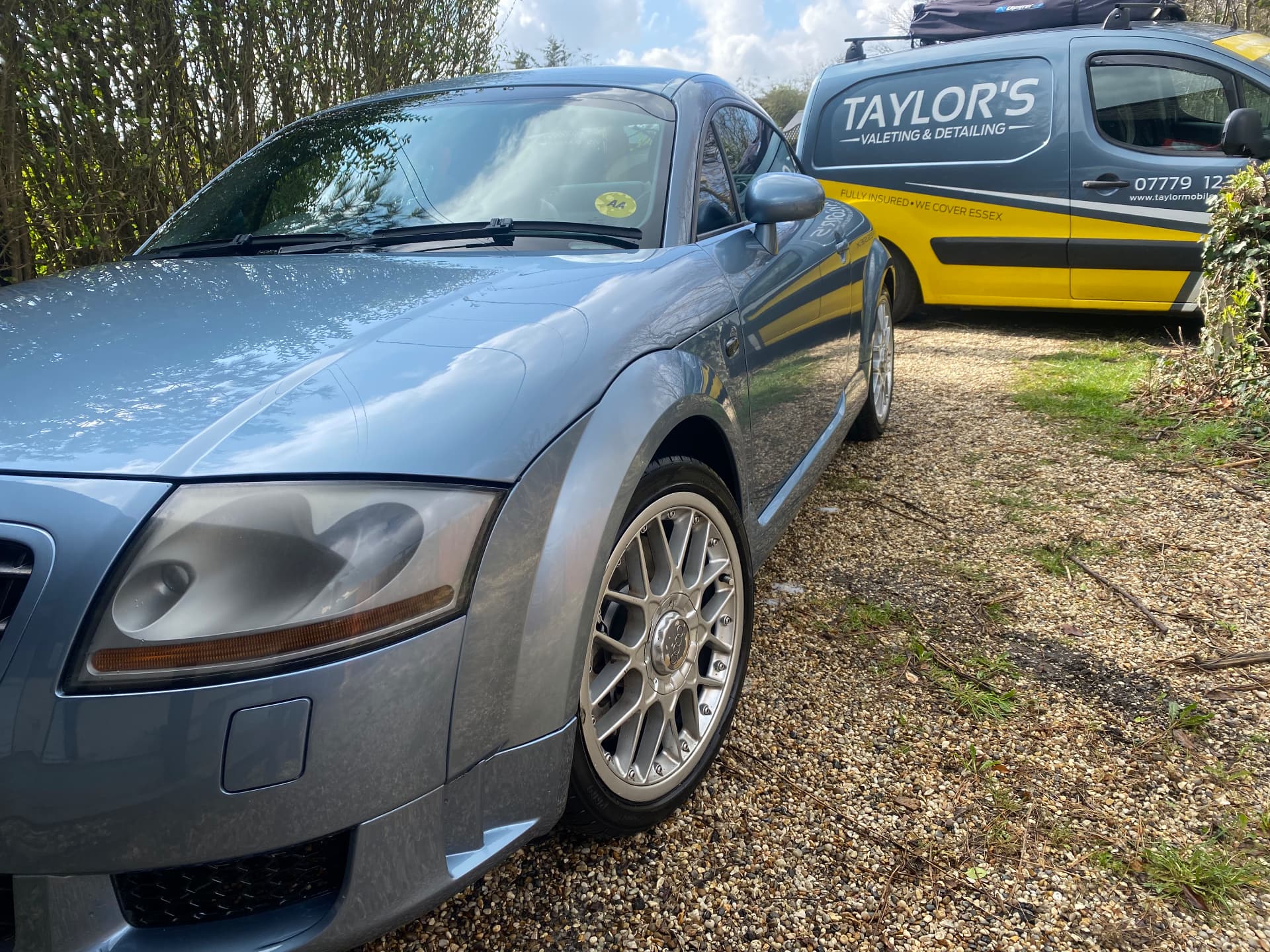 Silver-blue Audi TT quattro Sport polished beside the Taylor's valeting van