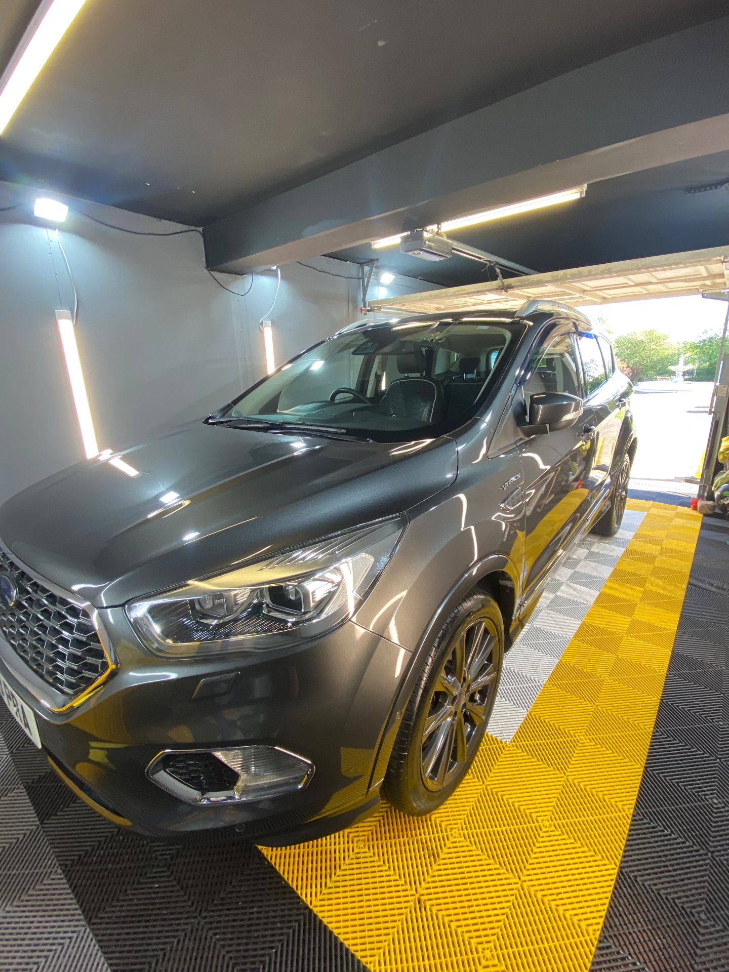 Grey Ford Kuga Vignale polished to a deep shine inside the unit