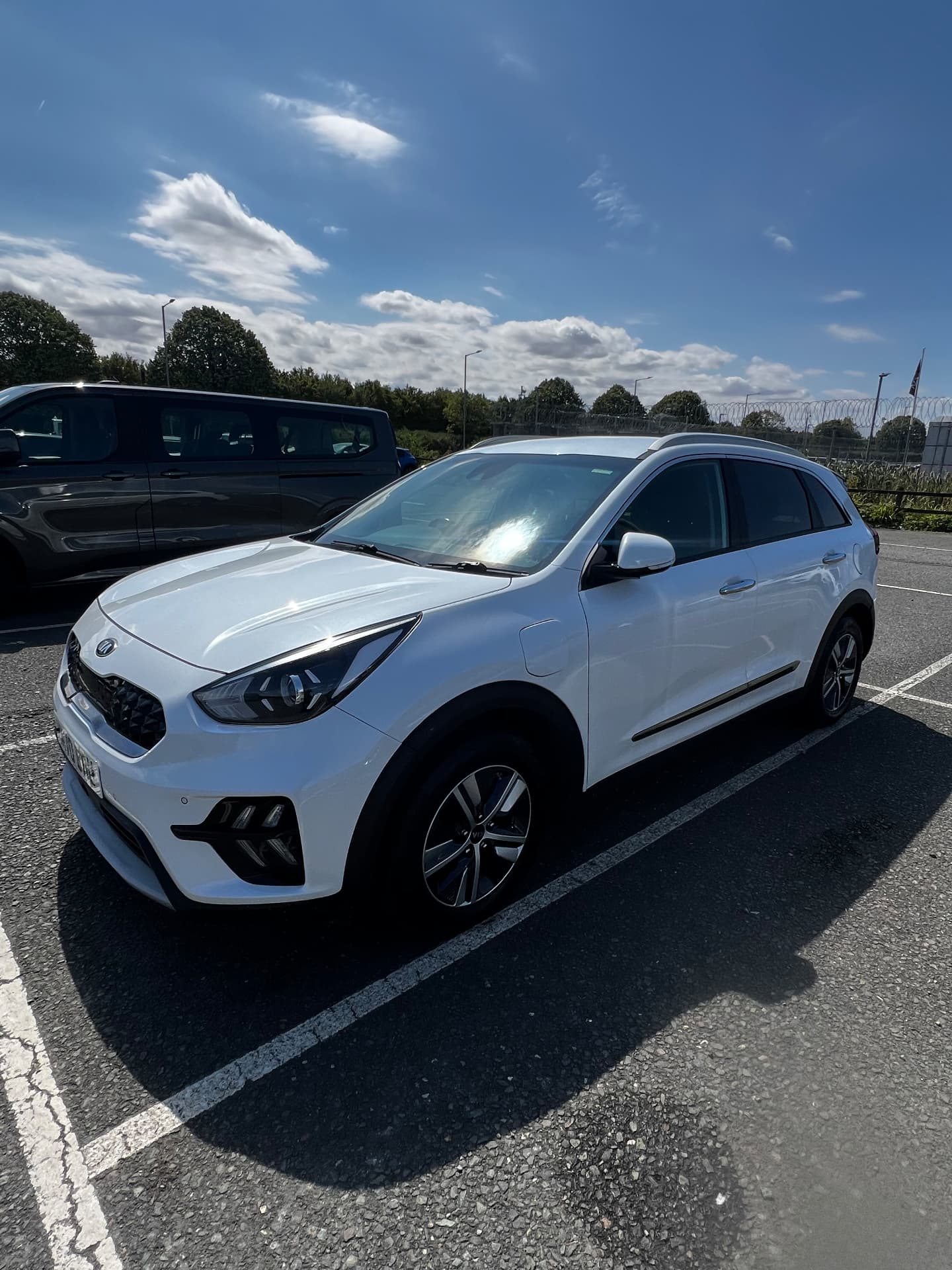 White Kia Niro washed and polished to a bright finish