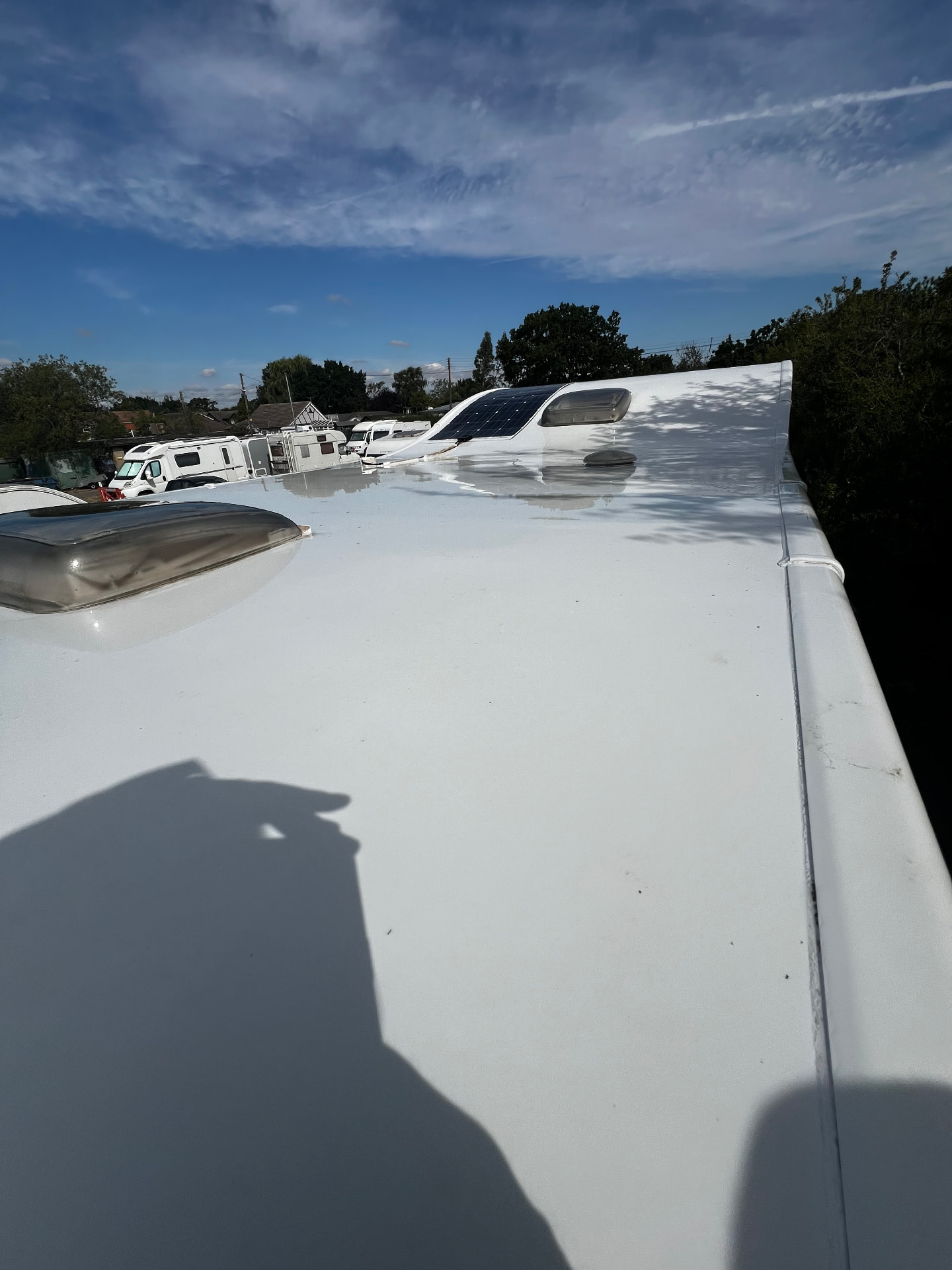 The same caravan roof restored to bright white after a deep clean